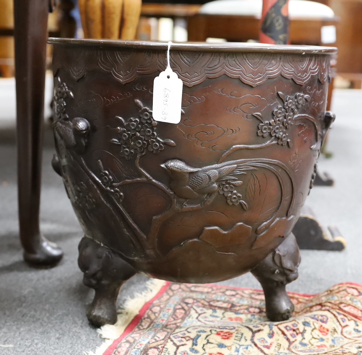 A Japanese bronze jardiniere, Meiji period, base lacking, 36cm high